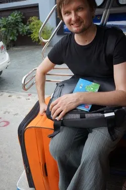 Riding in the back of a songthaew with luggage on Koh Samui